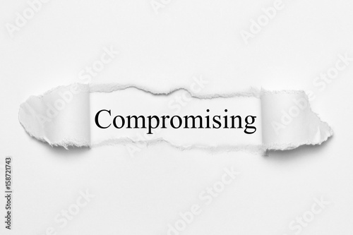 Compromising on white torn paper photo