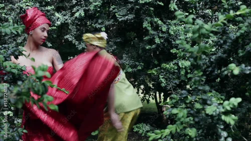 Father and adult daughter wearing traditional Brazilian clothing dancing together Father and adult daughter wearing traditional Brazilian clothing dancing together