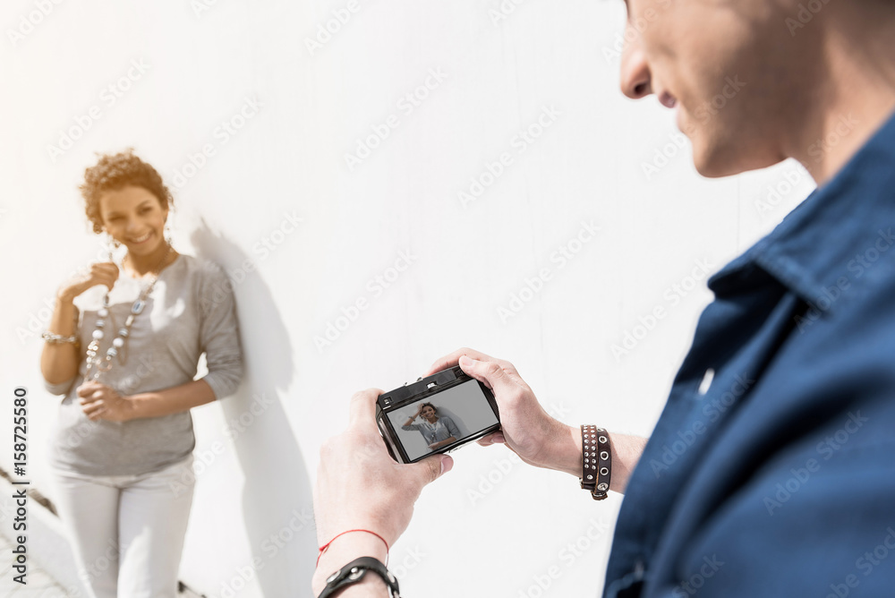 Romantic couple is arranging photosession outdoors Romantic couple is arranging photosession outdoors