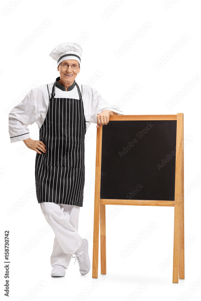 Chef standing by a blank blackboard Chef standing by a blank blackboard