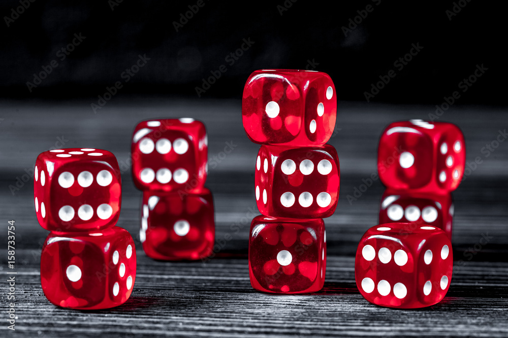 concept luck - dice gambling on dark wooden background concept luck - dice gambling on dark wooden background