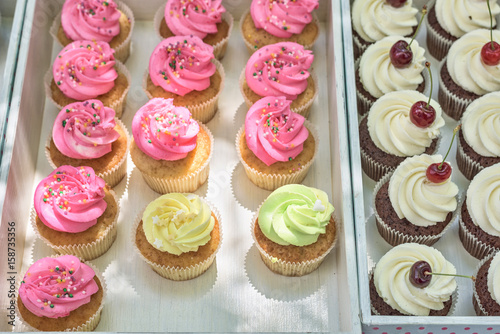 Cupcakes on a white table. Summer delicious colorful desserts