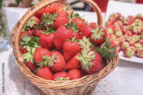 Fresh strawberries in a basket. Natural light