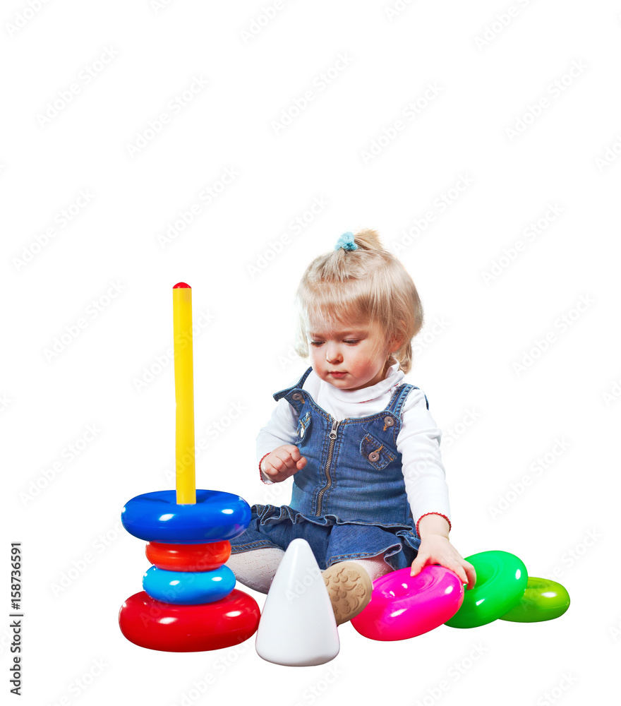Small kid is solving complicated huge puzzle isolated on white Small kid is solving complicated huge puzzle isolated on white