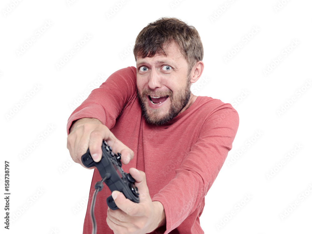 Portrait of adult bearded man holding joystick and playing videogames, isolated on white background Portrait of adult bearded man holding joystick and playing videogames, isolated on white background