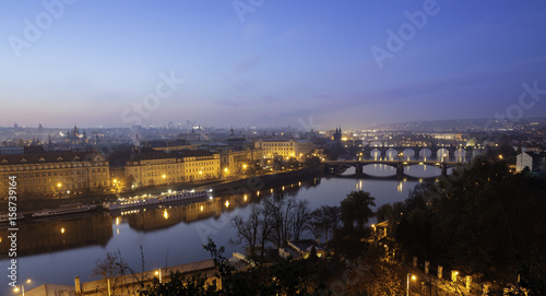 View of the Prague 1 (Old town) at morning daylight with beautiful colour at sky, and Vltava river with bridges on foreground.