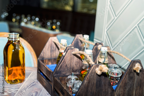 Set for restaurant incuding salt, pepper and oil photo