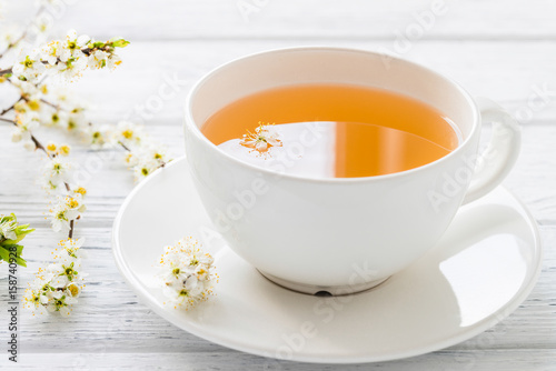 Fresh herbal tea with blooming brunch