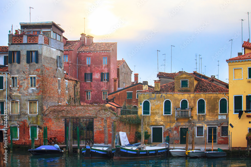 view of some buildings in Venice. The walls are old and worn out.