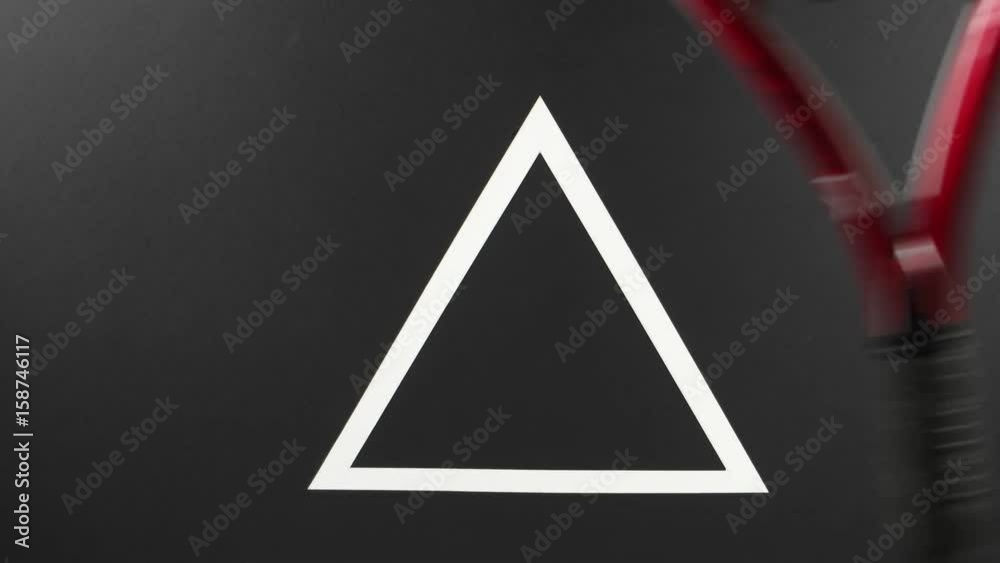 Rocking of a tennis racket on a black background Rocking of a tennis racket on a black background