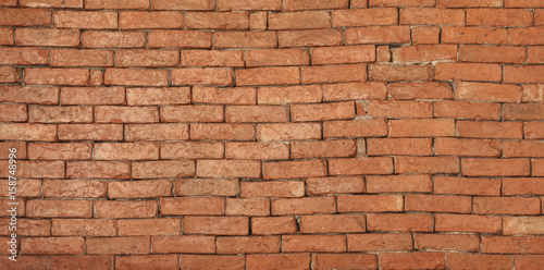 Red brick wall background with copy space.