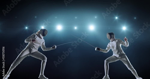 4K video in slow motion of two female fencing athletes. The action takes place on professional sports arena with spectators and lense-flares. Women wear unbranded sports clothes. Arena is made in 3D. photo