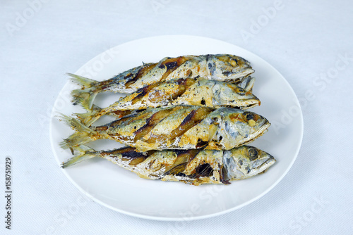 .Fried Short-bodied mackerel in white background, Thai food.