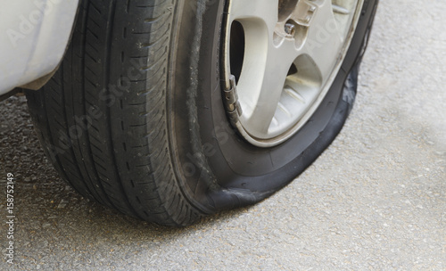 car wheel flat tire on the road.