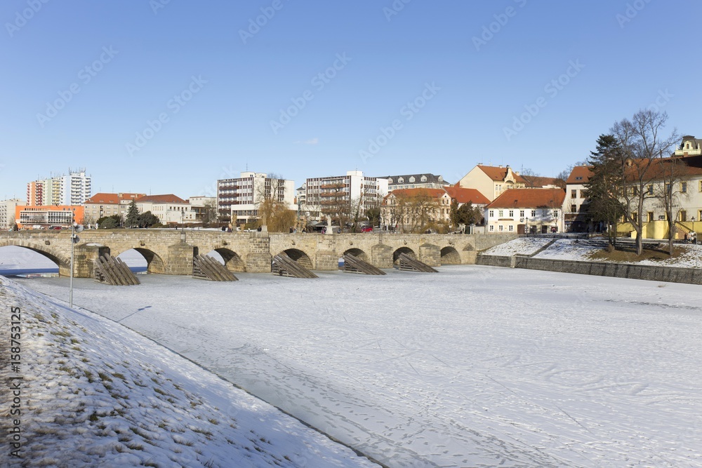 Fototapeta premium The oldest stone bridge in central Europe above River Otava, Pisek, Czech Republic