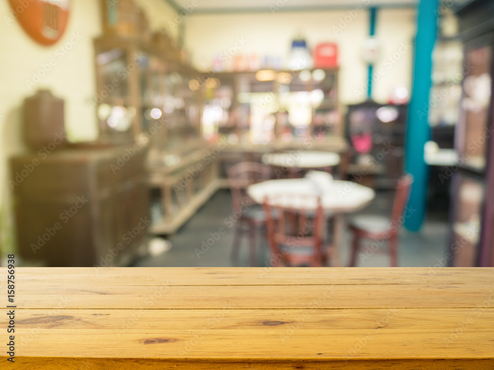 Wooden board empty table in front of blurred background. Perspective brown wood over blur in coffee shop or cafe- can be used for display or montage your products.Mock up your products.Vintage-filter. Wooden board empty table in front of blurred background. Perspective brown wood over blur in coffee shop or cafe- can be used for display or montage your products.Mock up your products.Vintage-filter.
