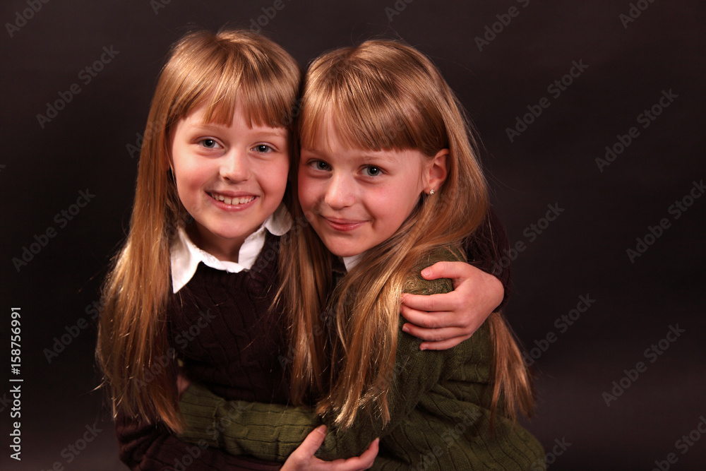 twin sisters hugging twin sisters hugging
