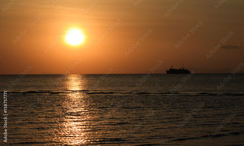 Sunset and boat in the sea
