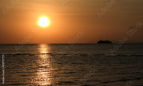 Sunset and boat in the sea © Jonas