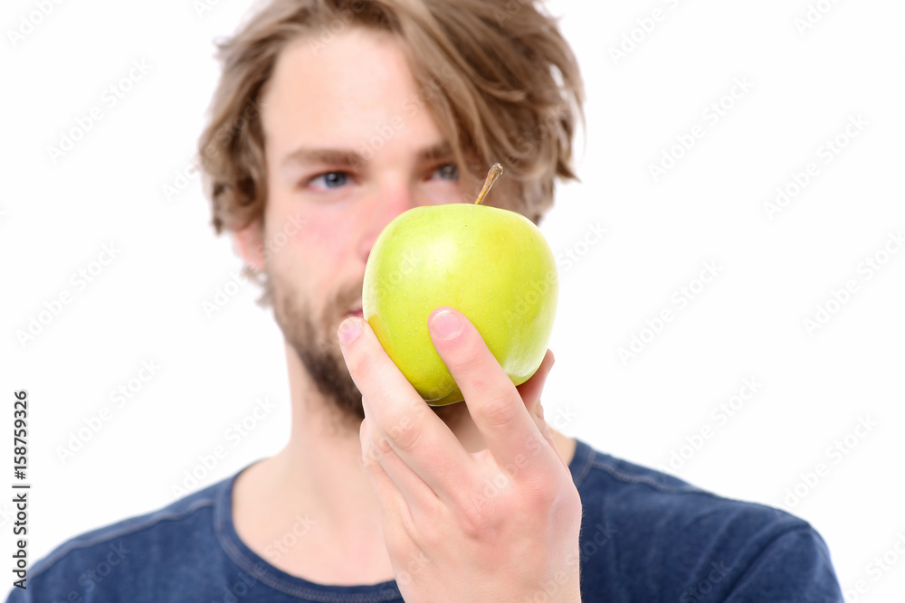 Apple of green colour in caucasian mans hand Apple of green colour in caucasian mans hand
