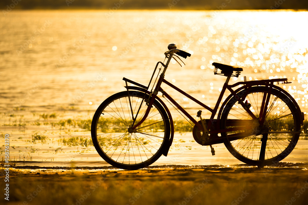bicycle silhouette at the sunset or sunrise