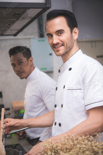 chef preparing food in the kitchen of a restaurant 