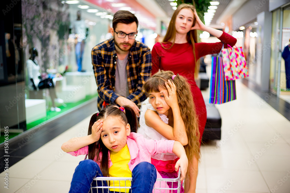 Fototapeta premium Family tired with shopping
