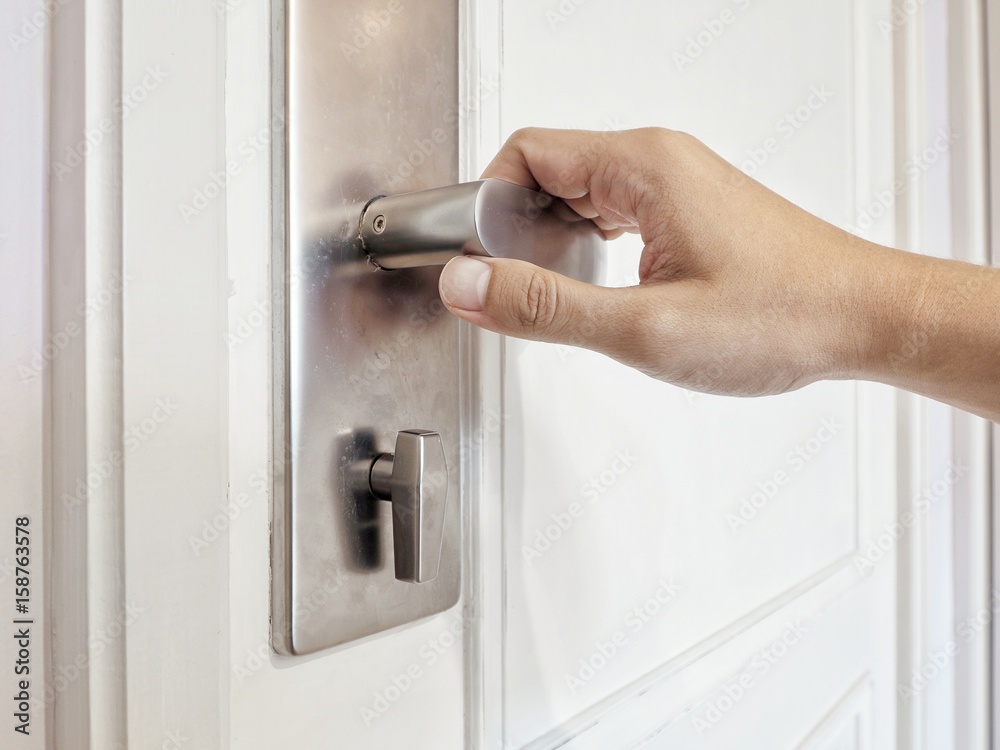 Hand man and modern door handle Hand man and modern door handle