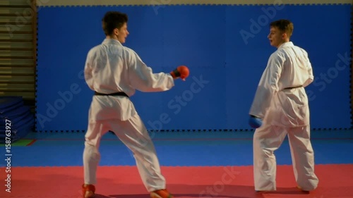 Kick box competition practice at the dojo in slow motion photo