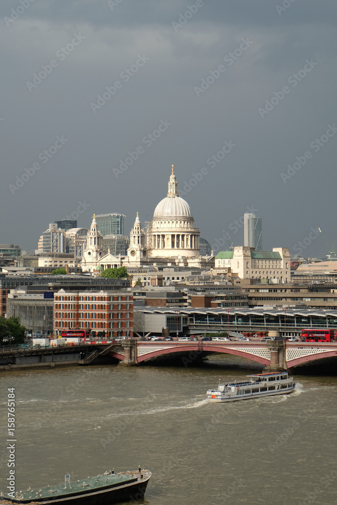 St Paul's Cathedral, London, UK with Blackfriars Bridge and the River Thames in the foreground.