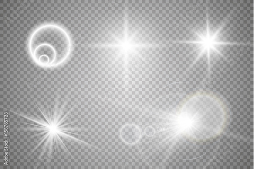 Set of golden glowing lights effects isolated on transparent background. Sun flash with rays and spotlight. Glow light effect. Star burst with sparkles.
 photo
