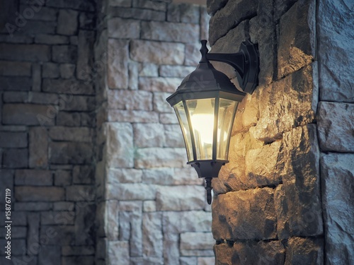 Classic retro lamp on stone wall. Interior decorate in vintage style.