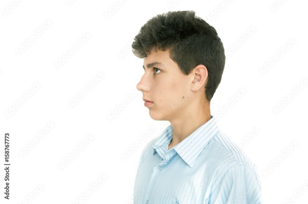 Cute boy looking to the side. Clearly visible profile of his face
