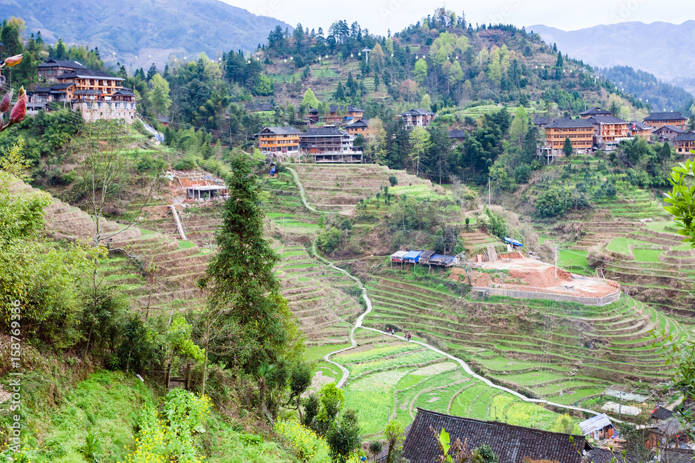 view of Dazhai village on terraced green hills