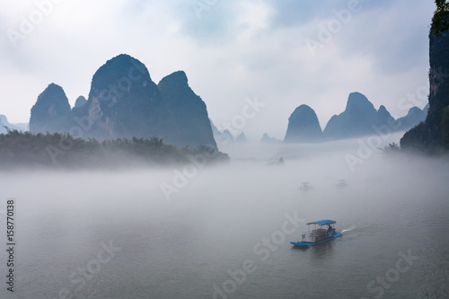 view of fog with ships on river near Xingping town photo