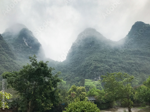 gray clouds over green karst peaks in Yangshuo