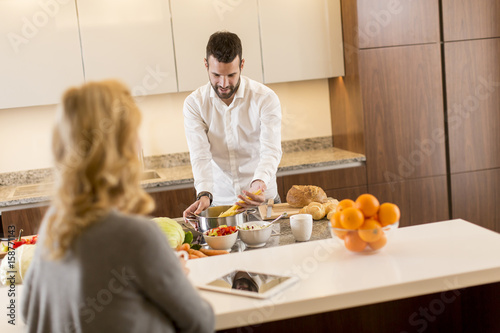 Man preparing a meal while ...