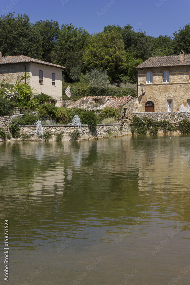 Bagno Vignoni medieval town with its square with hot spring thermal water, in Tuscany, Italy