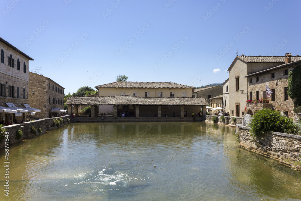 The small medieval town of Bagno Vignoni in Italy, with its hot spring thermal bath The small medieval town of Bagno Vignoni in Italy, with its hot spring thermal bath