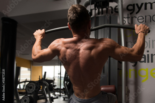 Athlete Doing Heavy Weight Exercise For Back