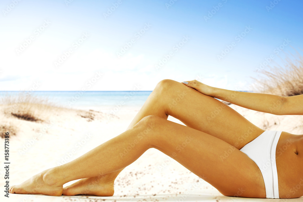 woman on beach in sexy bikini and slim body woman on beach in sexy bikini and slim body