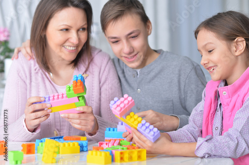  family collecting blocks together