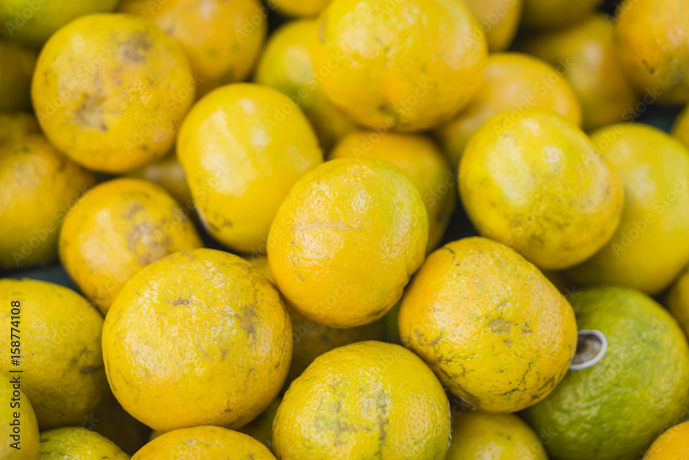 oranges fruit on market stall,with chinese new year background, in market,selective focus. oranges fruit on market stall,with chinese new year background, in market,selective focus.