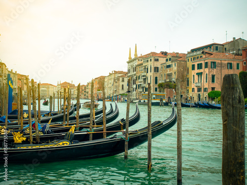 Gondolas parks on canal in Venice, Italy
