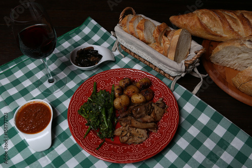 Italian dinner with breads, water and wine, table tidy