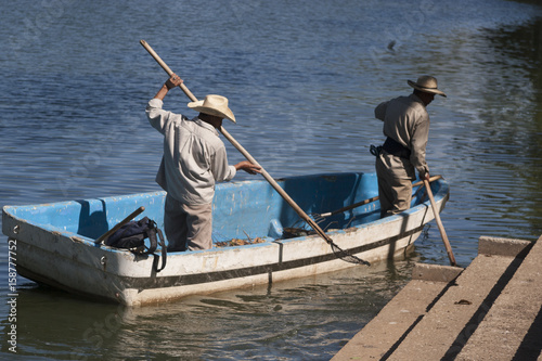 Two man on boat. Lagoon of illusions, Tomas Garrido Canabal Park, Villahermosa, Tabasco, Mexico.	 photo