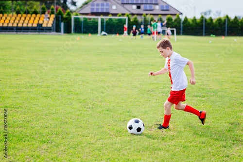 8 years old boy child playing football