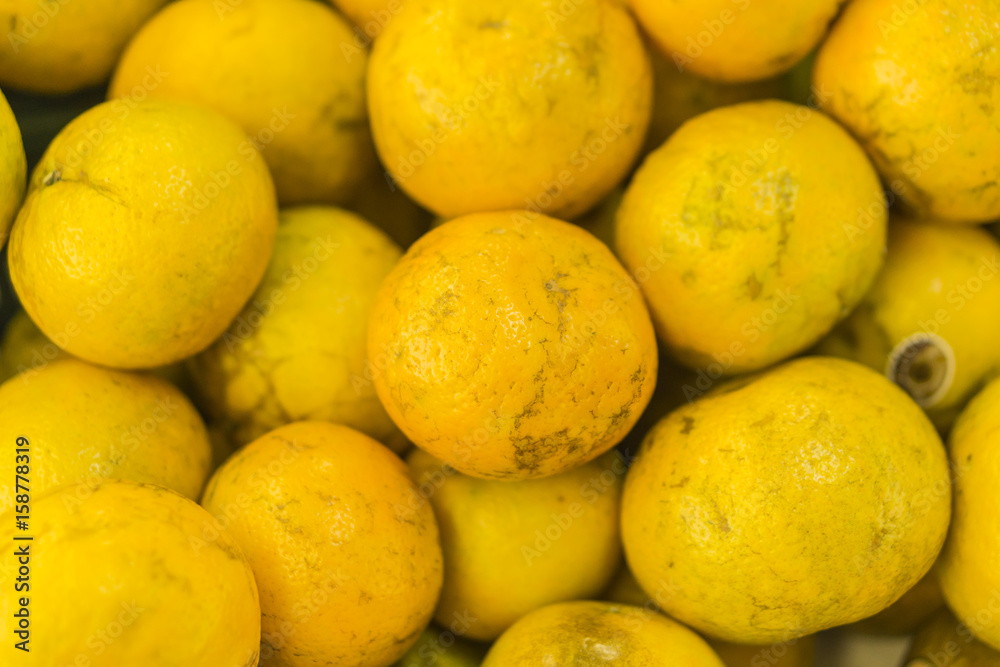 oranges fruit on market stall,with chinese new year background, in market,selective focus. oranges fruit on market stall,with chinese new year background, in market,selective focus.