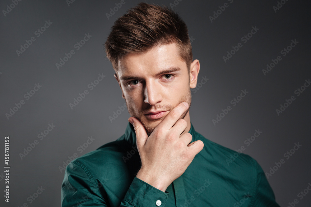 Concentrated serious young man posing Concentrated serious young man posing