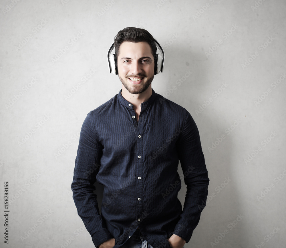 Smiling guy wearing headphones Smiling guy wearing headphones